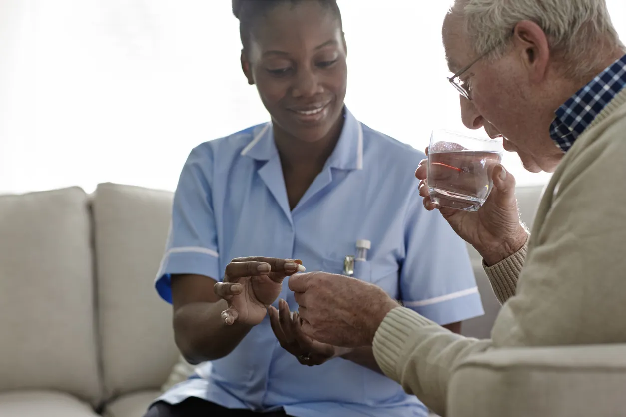 Nurse reviewing medications with a client